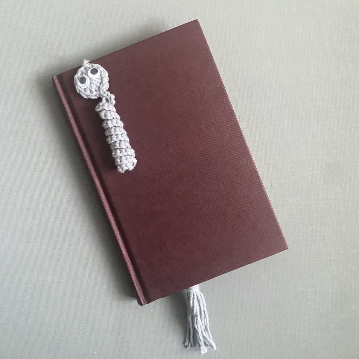 grey bookworm (worry worm) bookmark with googly eyes