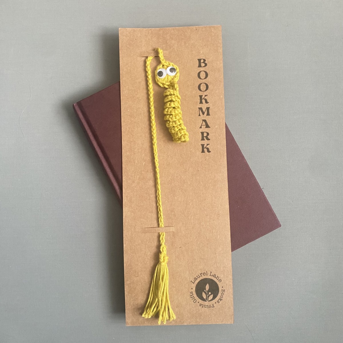 yellow bookworm (worry worm) bookmark with googly eyes